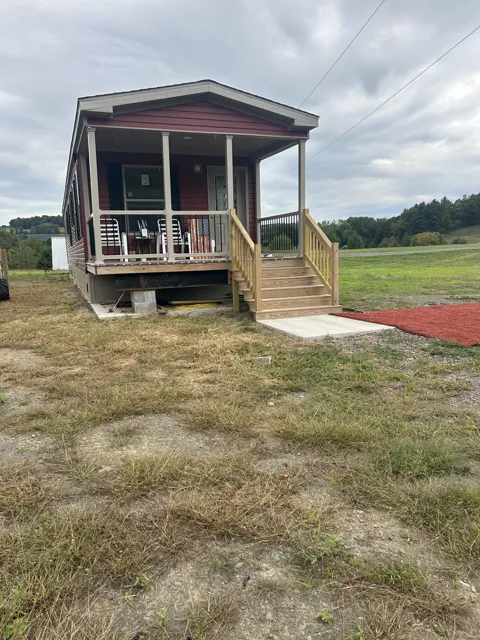 Camp exterior at its offsite viewing location, front porch