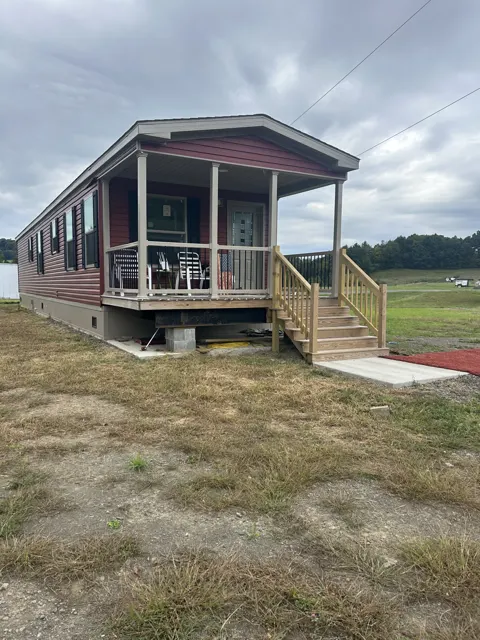 Camp exterior at its offsite viewing location, front and side view