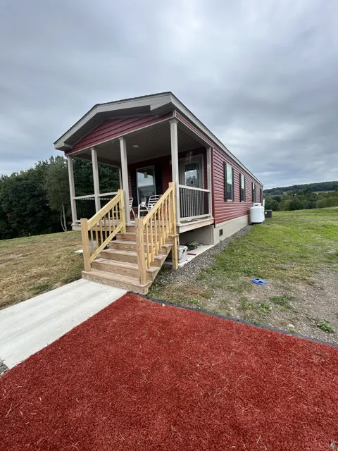 Camp exterior at its offsite viewing location, front and opposite side view